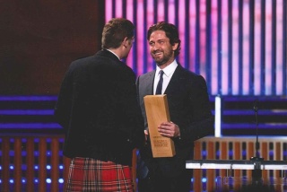 Magnus MacFarlane-Barrow and Gerard Butler on stage at CNN Heroes award ceremony