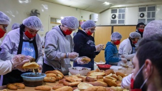 Volunteers for Dorcas preparing food 