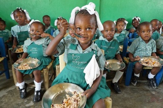 Children in Haiti eating Mary's Meals