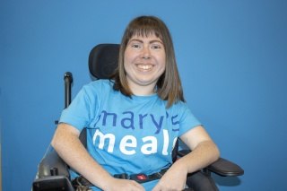 Mary's Meals volunteer pictured smiling at camera