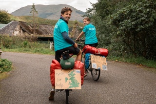 Jacob and Lucia on their bikes in Mary's Meals blue t-shirts