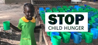 child in South Sudan holding food