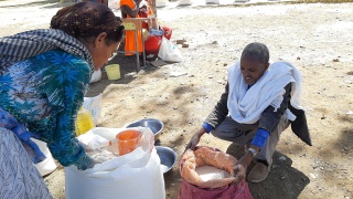 A displaced person in Ethiopia receiving a food ration