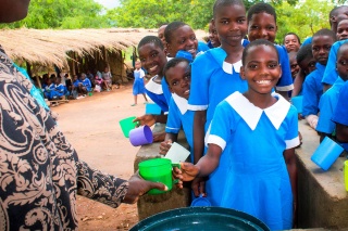 Children receiving their school meals