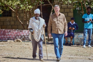 Magnus MacFarlane-Barrow meeting community members in Tigray, Ethiopia