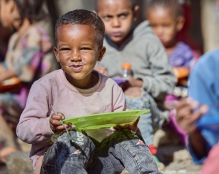Child in Ethiopia with school meal