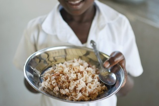 Image of child holding food