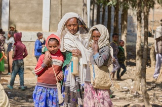 Children and an adult outside Gendet Primary School, Ethiopia