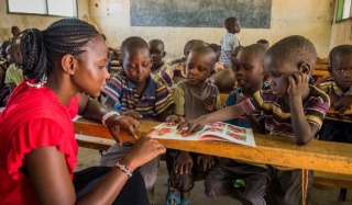 Work for us_Mary's Meals_Teacher and Children at School