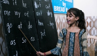 Work for us_Mary's Meals_Child at Chalk Board