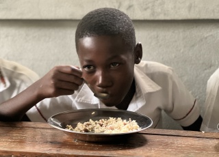 Child eating in Haiti