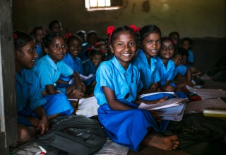 Image of child in classroom in India learning