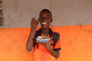 Child eating Mary's Meals