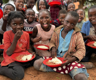 Children eating Mary's Meals