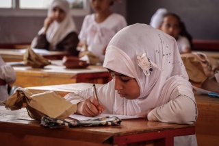 Girl studying in classroom