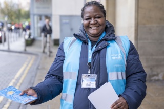 Mary's Meals volunteer with flyers