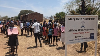 A school in South Sudan, with a sign reading Mary Help Association