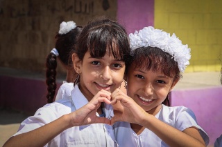 Girls in Yemen after they have received their school meals