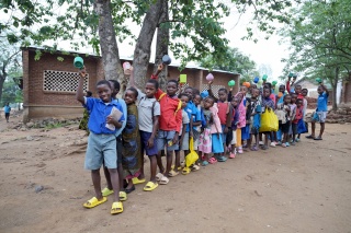 Children queueing for porridge
