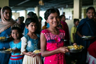 Image of a child in India with their school meal