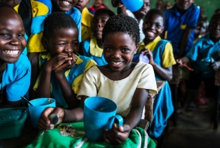 children eating Mary's Meals in Malawi