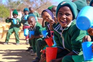 Image of a child eanjoying their school meal