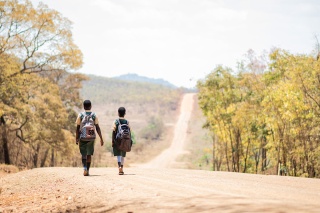 To children walking on long road to school
