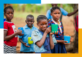 Image of a child holding their school meal