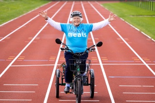 Image of Marys Meals supporter cycling to rasie money for charity