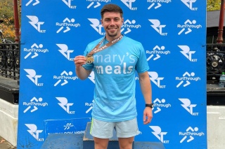 Image of Mary's Meals runner with medal