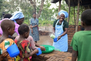 Image of Mary's Meals volunteers providing school meals in Malawi