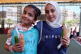 Image of two children happy with their school meals