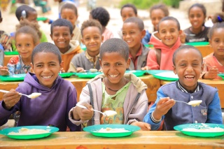 Children eating Mary's Meals' porridge in Ethiopia