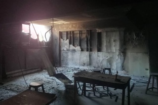 Image of a fire damaged classroom in Haiti