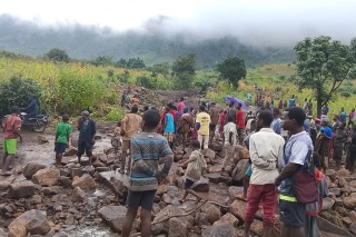 Image of people in Malawi inspecting flood damage