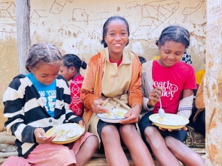 Valicia and friends with their school meal in Madagascar