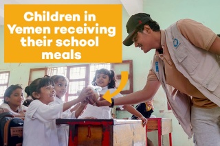An image of children in Yemen being given their school meals