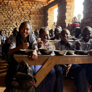 Samar and classmates enjoying their school meals