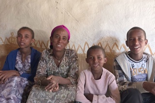 Kidan and her three children at home in Ethiopia