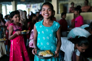 Children in India enjoying their school meal