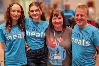 An image of Mary's Melas supporter hugging