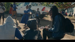 Lettie interviewing a child who receives Mary’s Meals