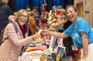 Happy shoppers at Glasgow Christmas market. Mary's Meals - a school feeding charity helping hungry children - will have a stall at this year's Glasgow Christmas market.